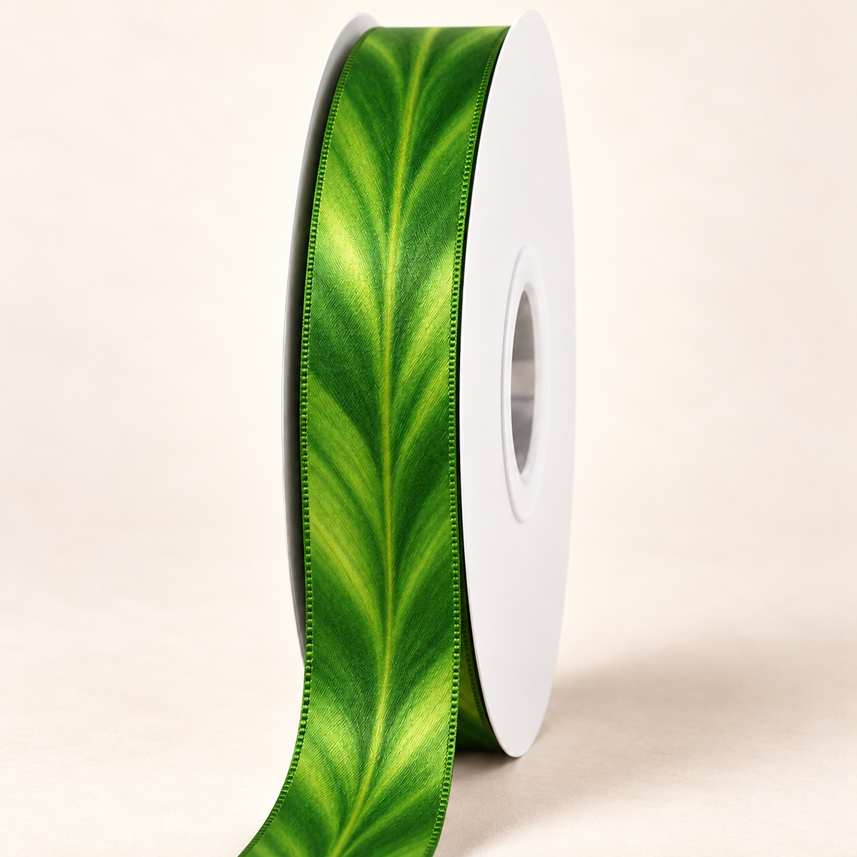 Rainforest Ti — 22 mm satin ribbon on a white roll against an ivory background