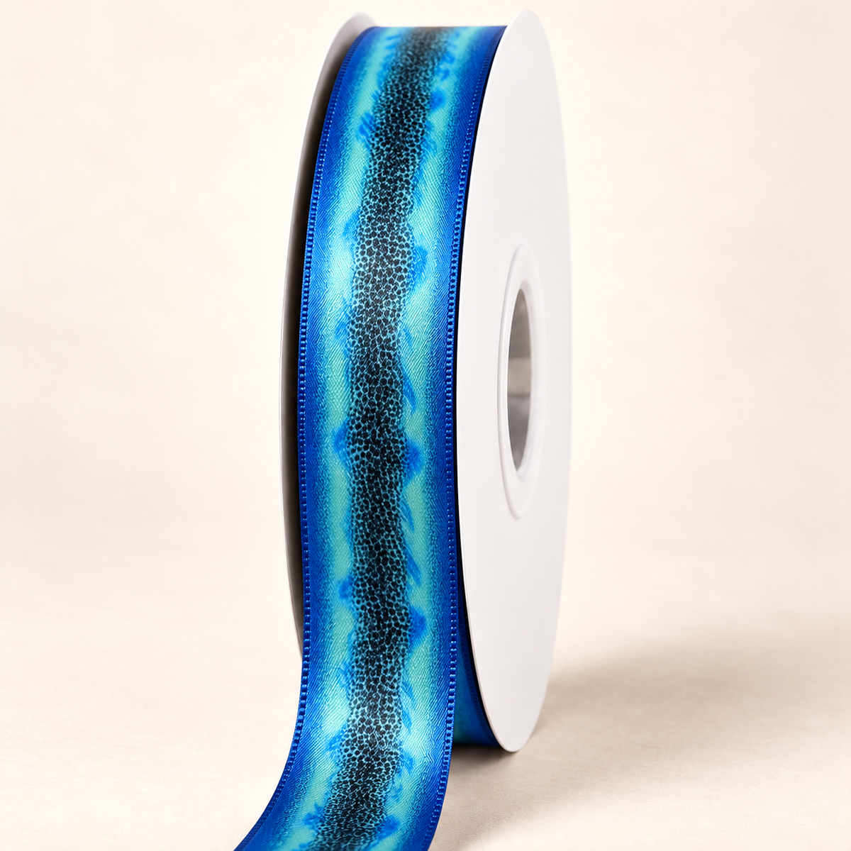 Sapphire Tiger Orchid - Double-Faced Satin Ribbon — 22 mm satin ribbon on a white roll against an ivory background
