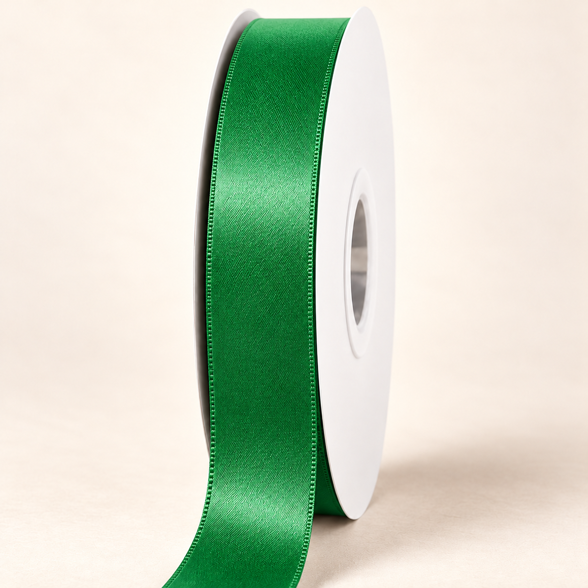 Fern Green — 22 mm satin ribbon on a white roll against an ivory background