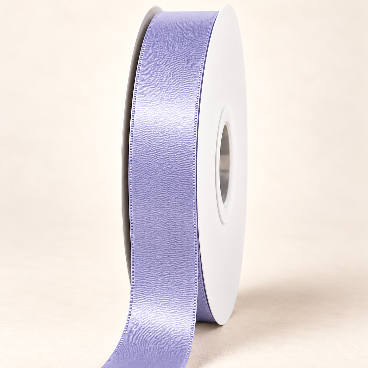 Thistle — 22 mm satin ribbon on a white roll against an ivory background