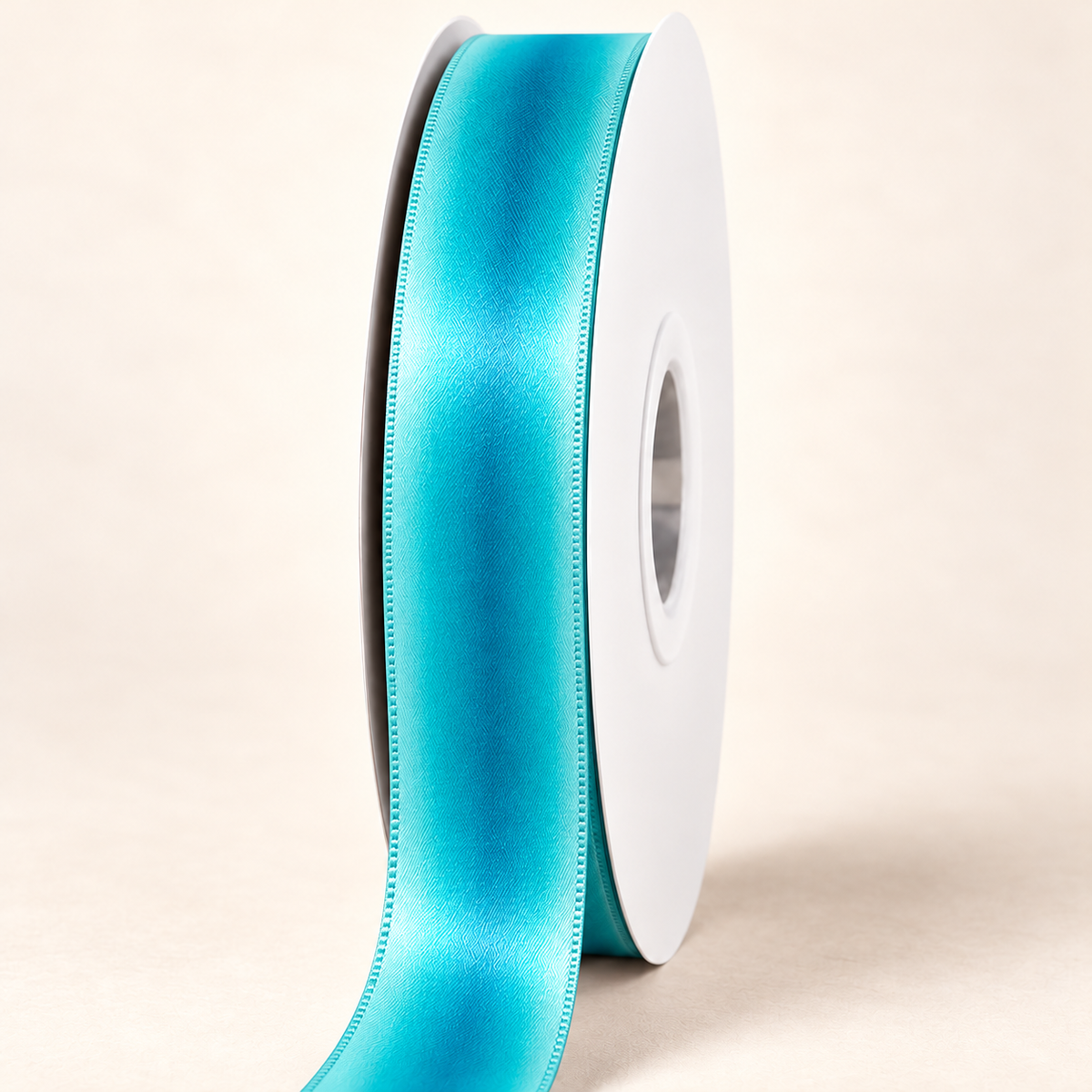 Blue Hawaiian Double-faced Satin Ribbon — 22 mm satin ribbon on a white roll against an ivory background