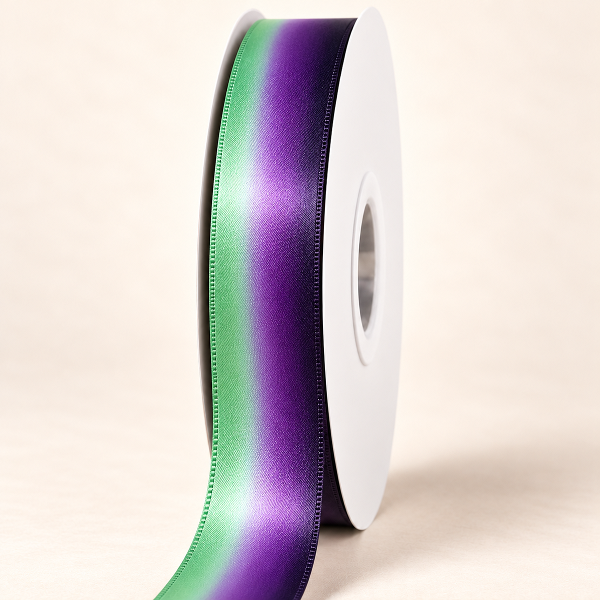 Borealis mint green and deep purple ombré satin ribbon on a white spool