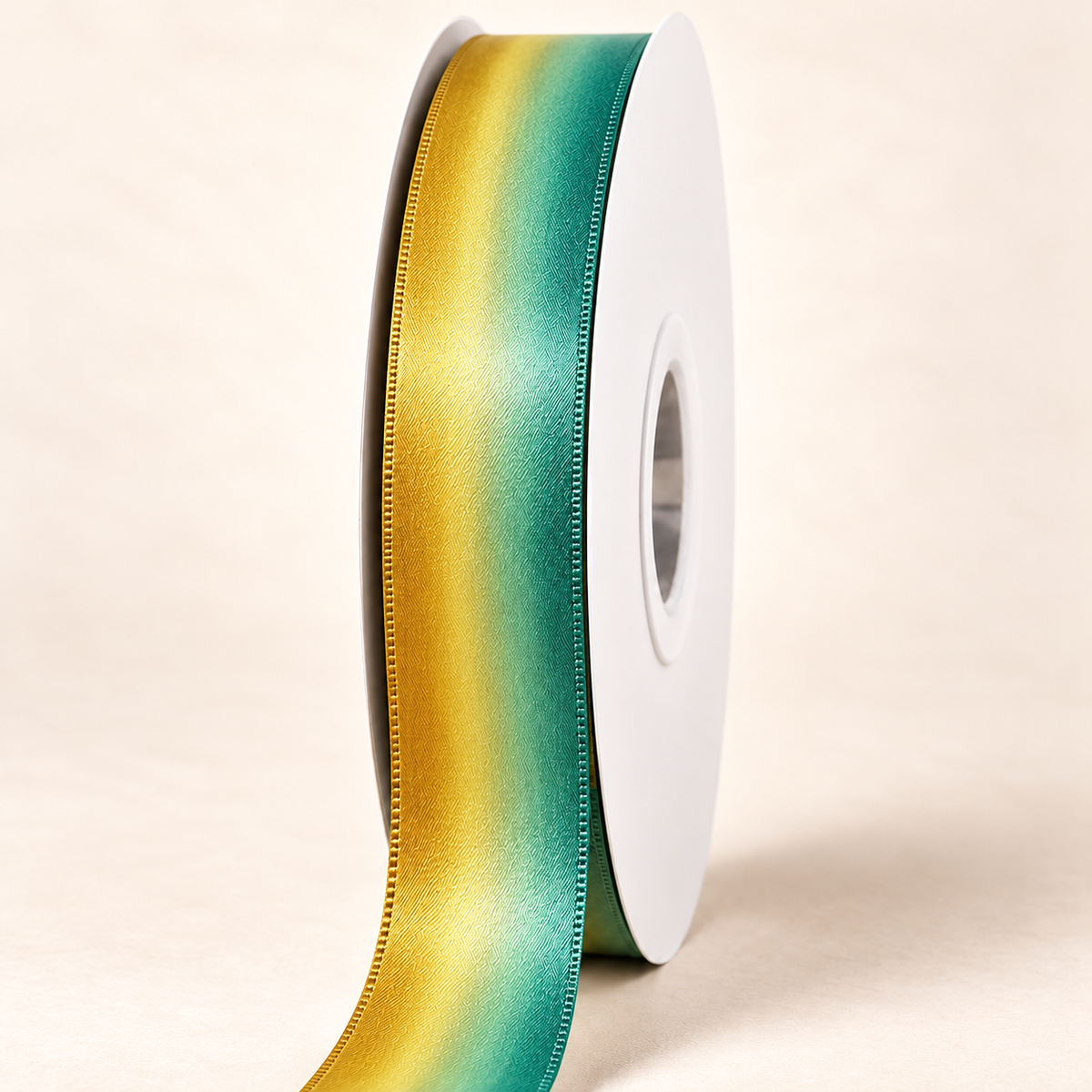 Golden Cove satin ribbon on a white spool with golden yellow and seafoam green