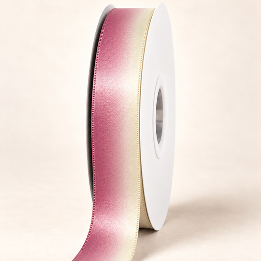 Guava Creme Satin Ribbon — 22 mm satin ribbon on a white roll against an ivory background