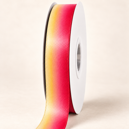 Lava Flow Double-faced Satin Ribbon — 22 mm satin ribbon on a white roll against an ivory background