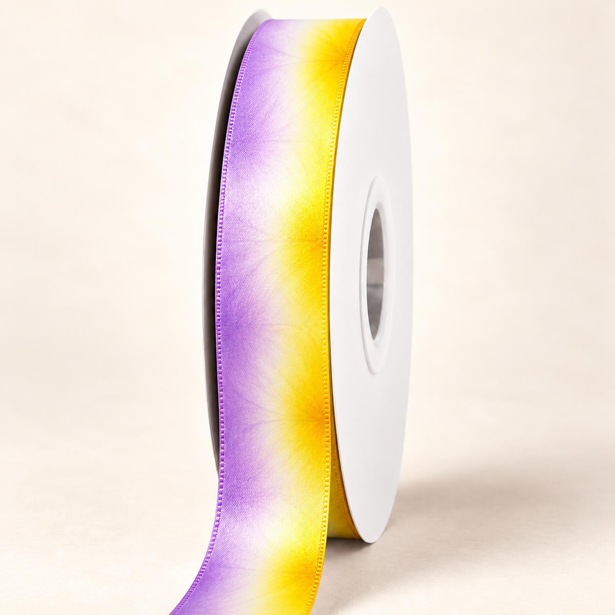 Lilikoi Dawn Satin Ribbon — 22 mm satin ribbon on a white roll against an ivory background