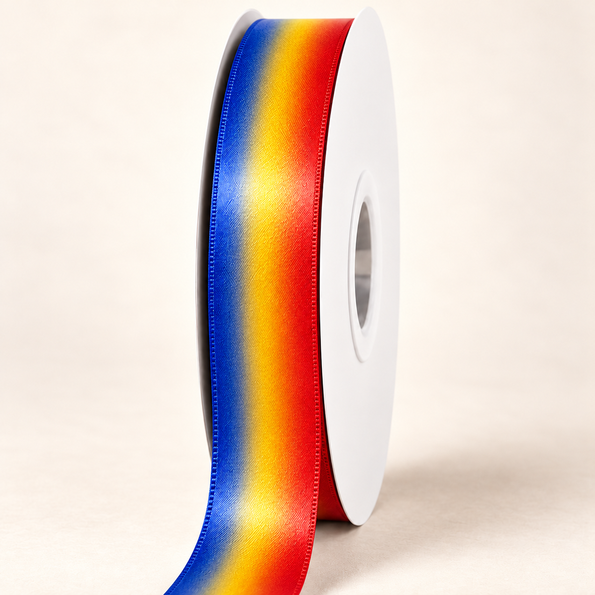 Maharlika Flame — 22 mm satin ribbon on a white roll against an ivory background