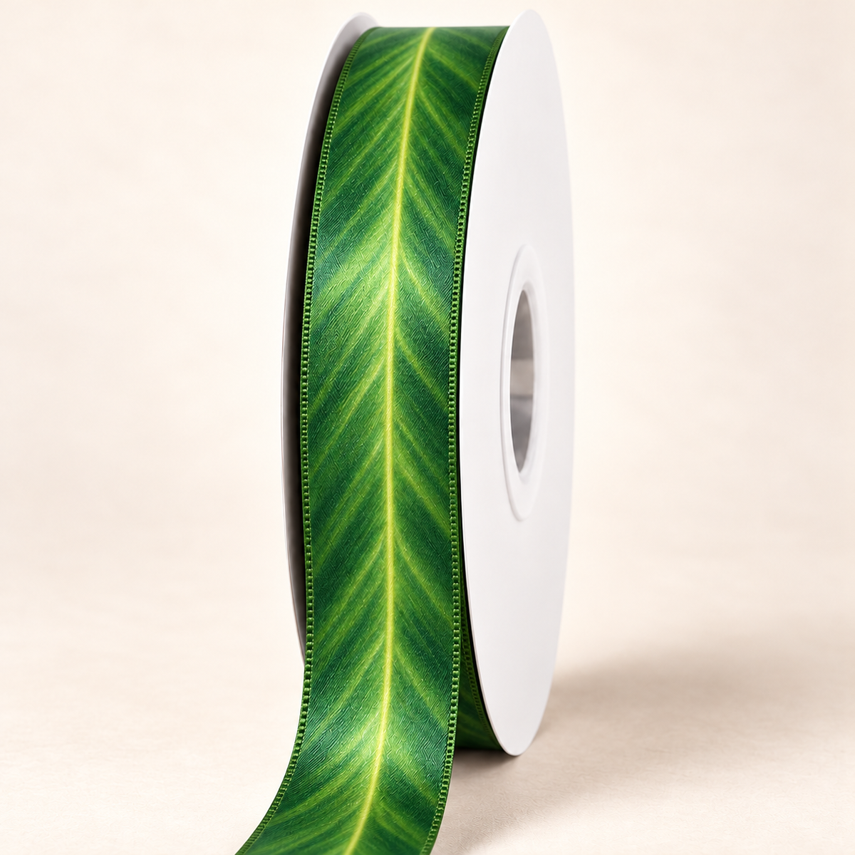 Midnight Kalo — 22 mm satin ribbon on a white roll against an ivory background