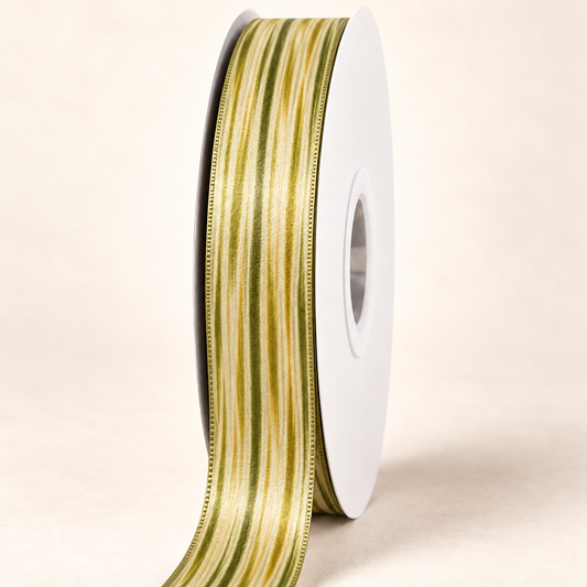 Niu Gold Satin Ribbon — 22 mm satin ribbon on a white roll against an ivory background