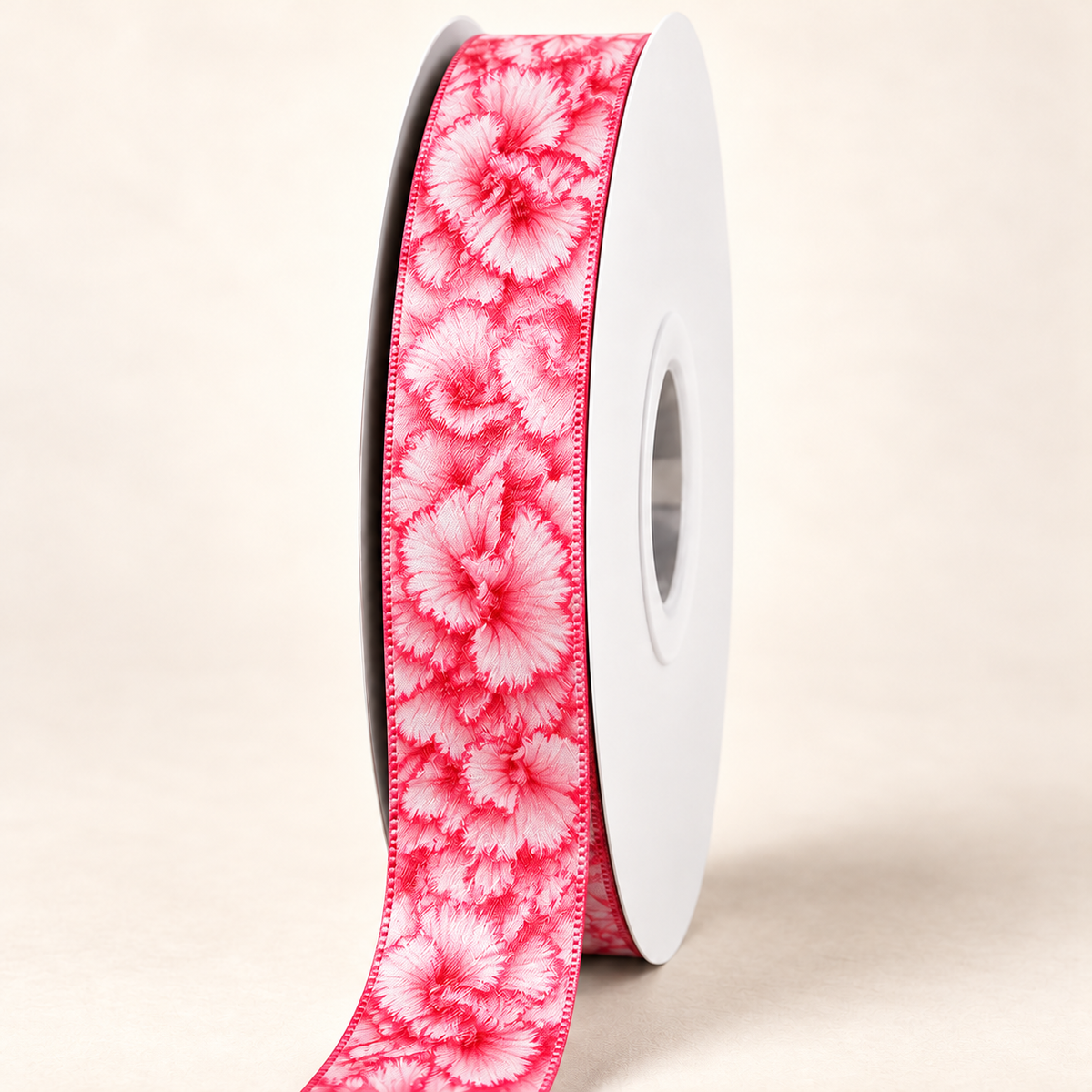 Pink Carnation Double-sided Satin Ribbon — 22 mm satin ribbon on a white roll against an ivory background