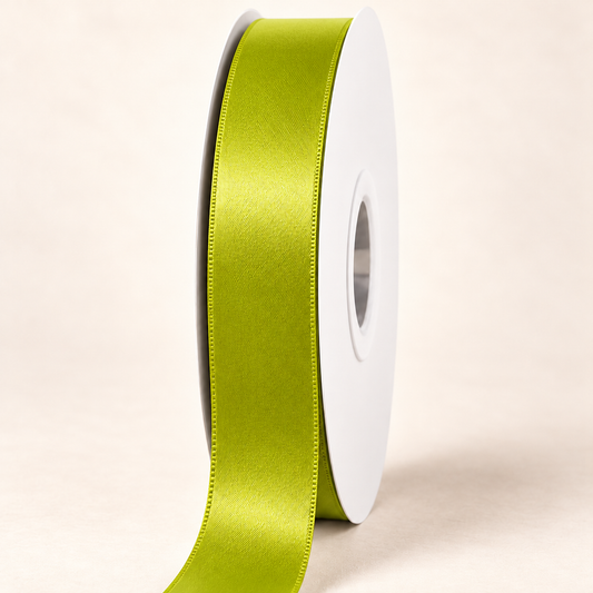 Acid Green — 22 mm satin ribbon on a white roll against an ivory background
