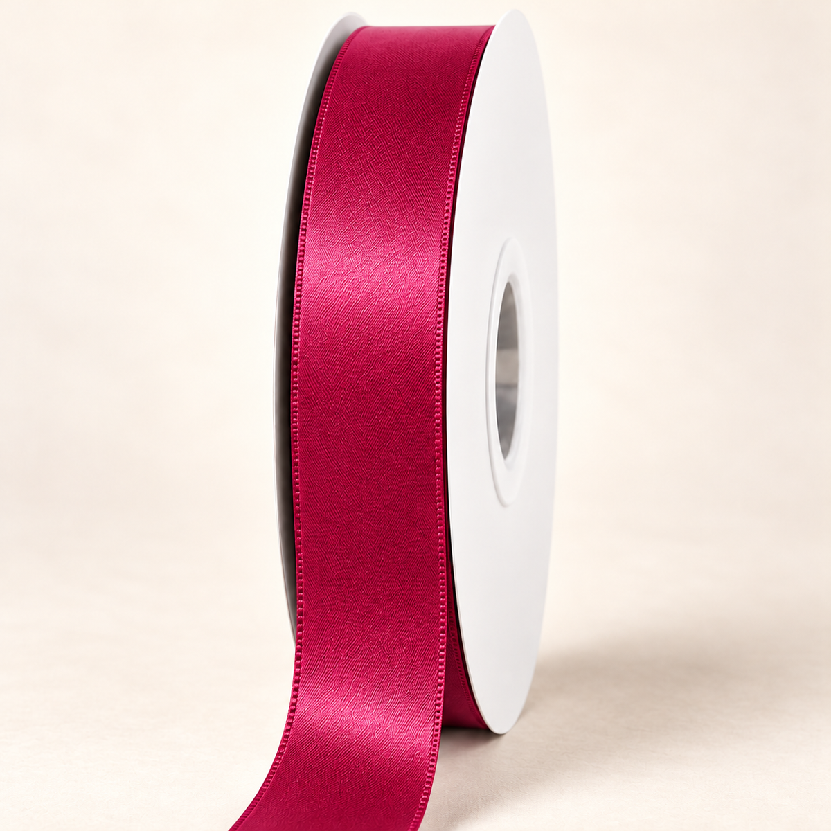 Beauty — 22 mm satin ribbon on a white roll against an ivory background