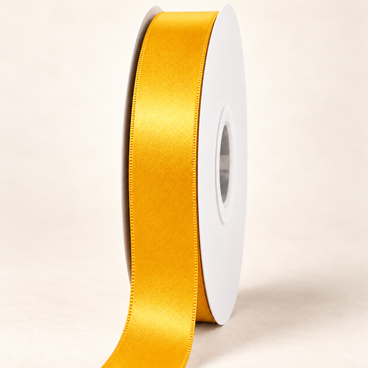 Dandelion — 22 mm satin ribbon on a white roll against an ivory background