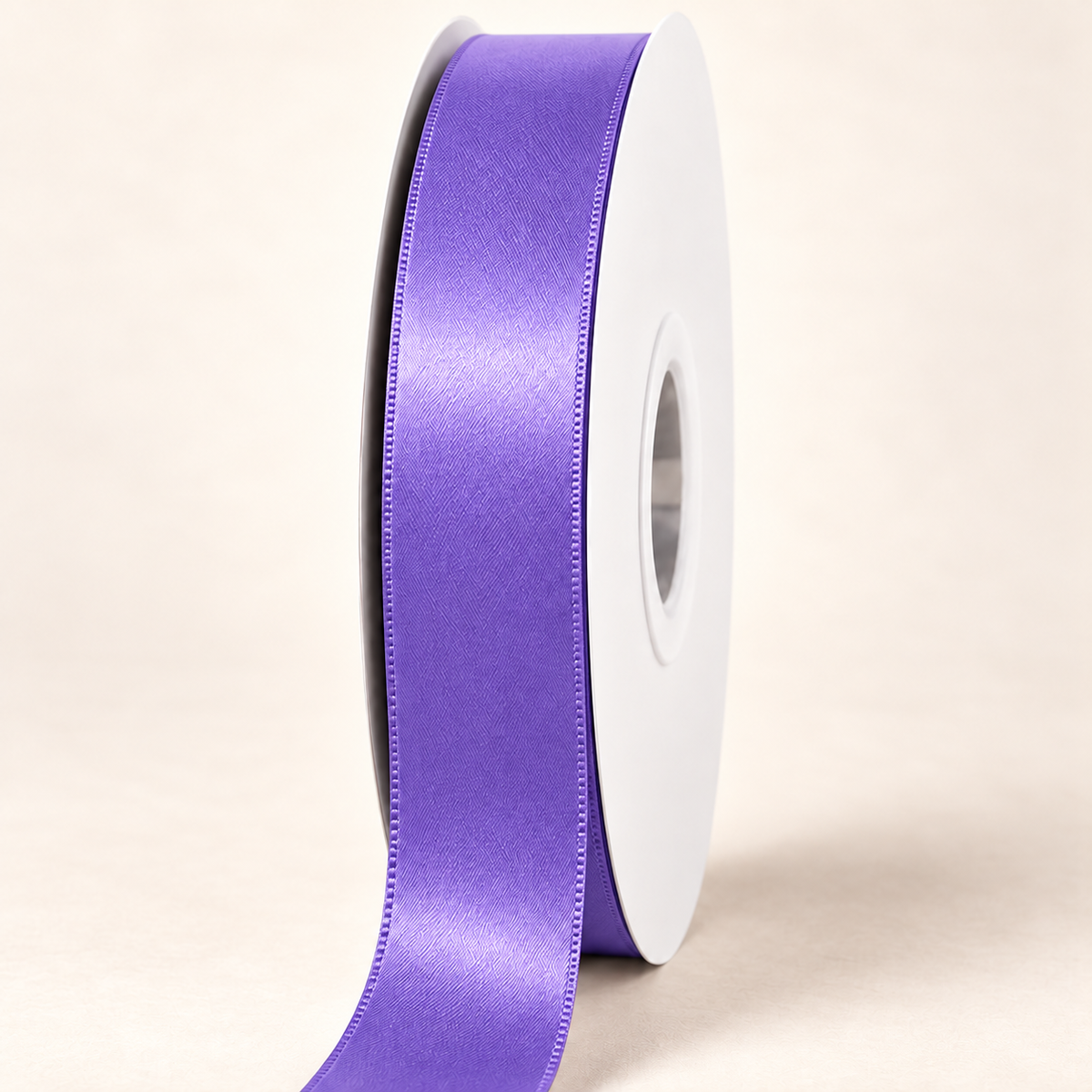 Delphinium — 22 mm satin ribbon on a white roll against an ivory background