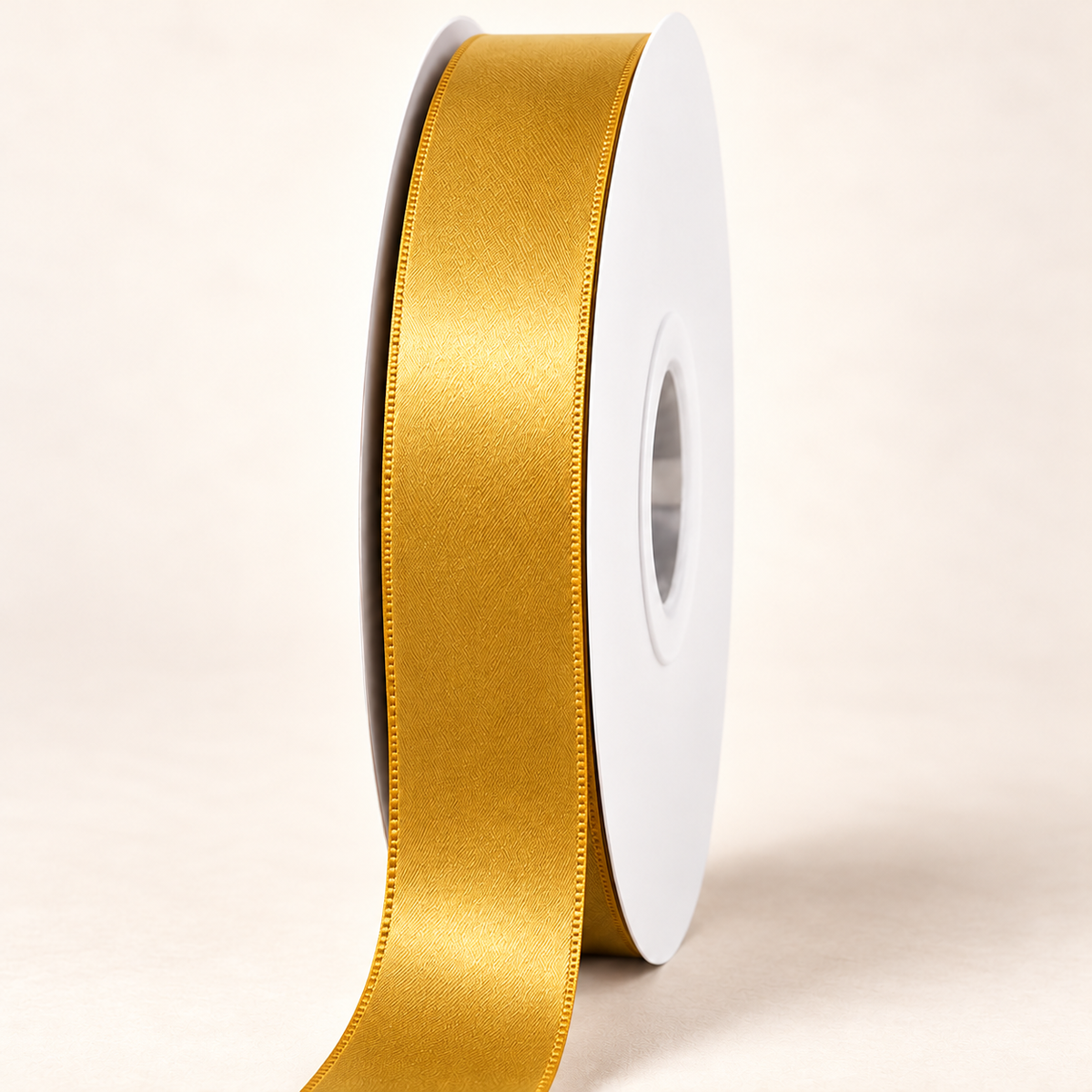 Dijon — 22 mm satin ribbon on a white roll against an ivory background