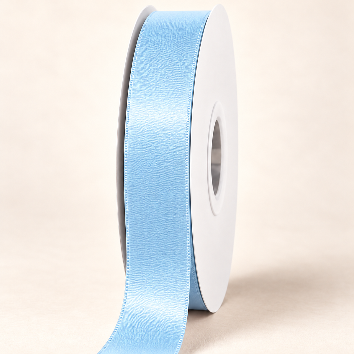 Light Blue — 22 mm satin ribbon on a white roll against an ivory background
