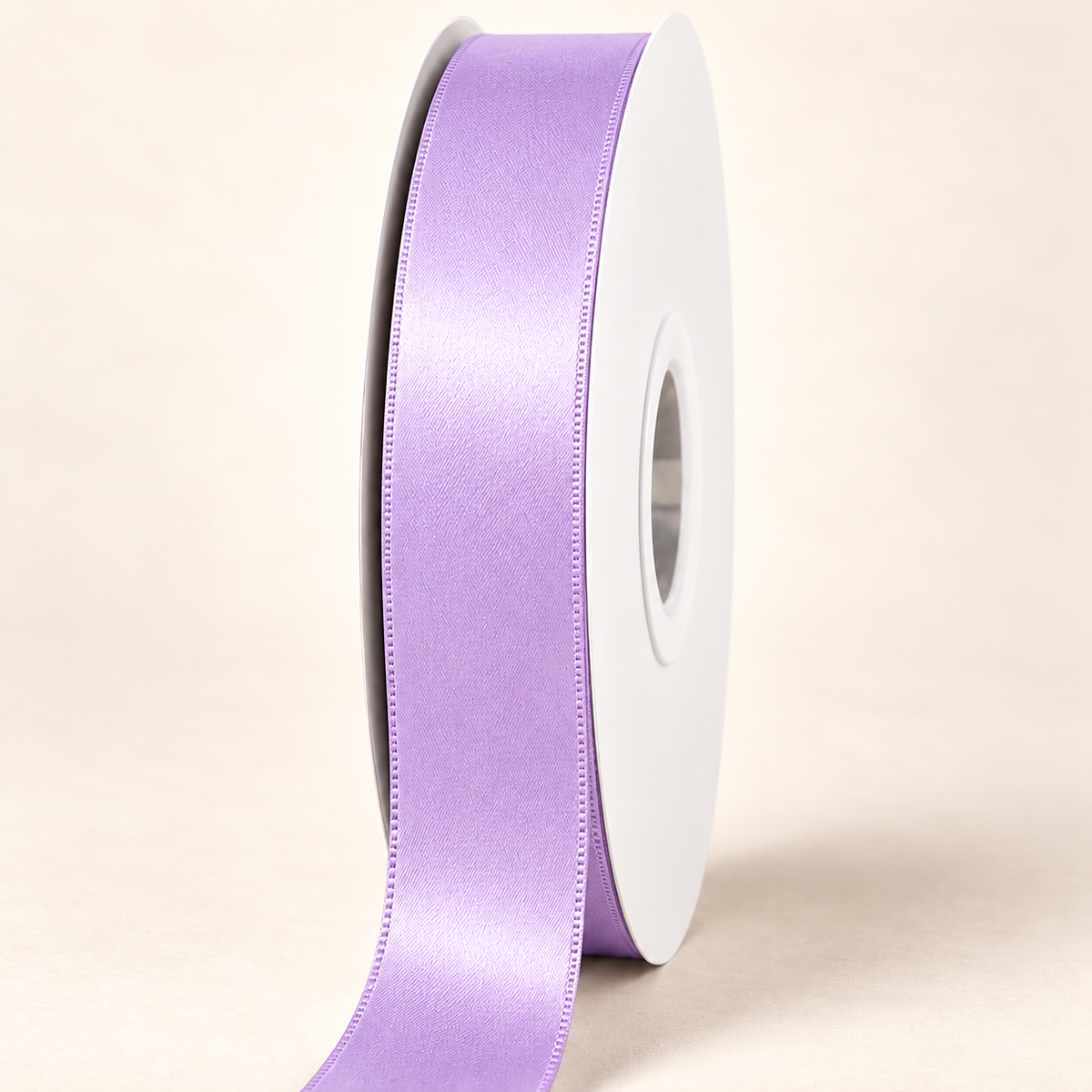 Light Orchid — 22 mm satin ribbon on a white roll against an ivory background