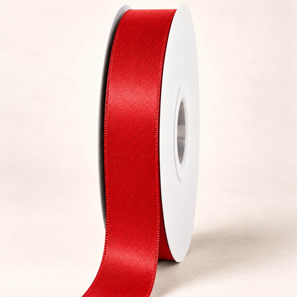 Red — 22 mm satin ribbon on a white roll against an ivory background