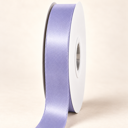 Thistle — 22 mm satin ribbon on a white roll against an ivory background