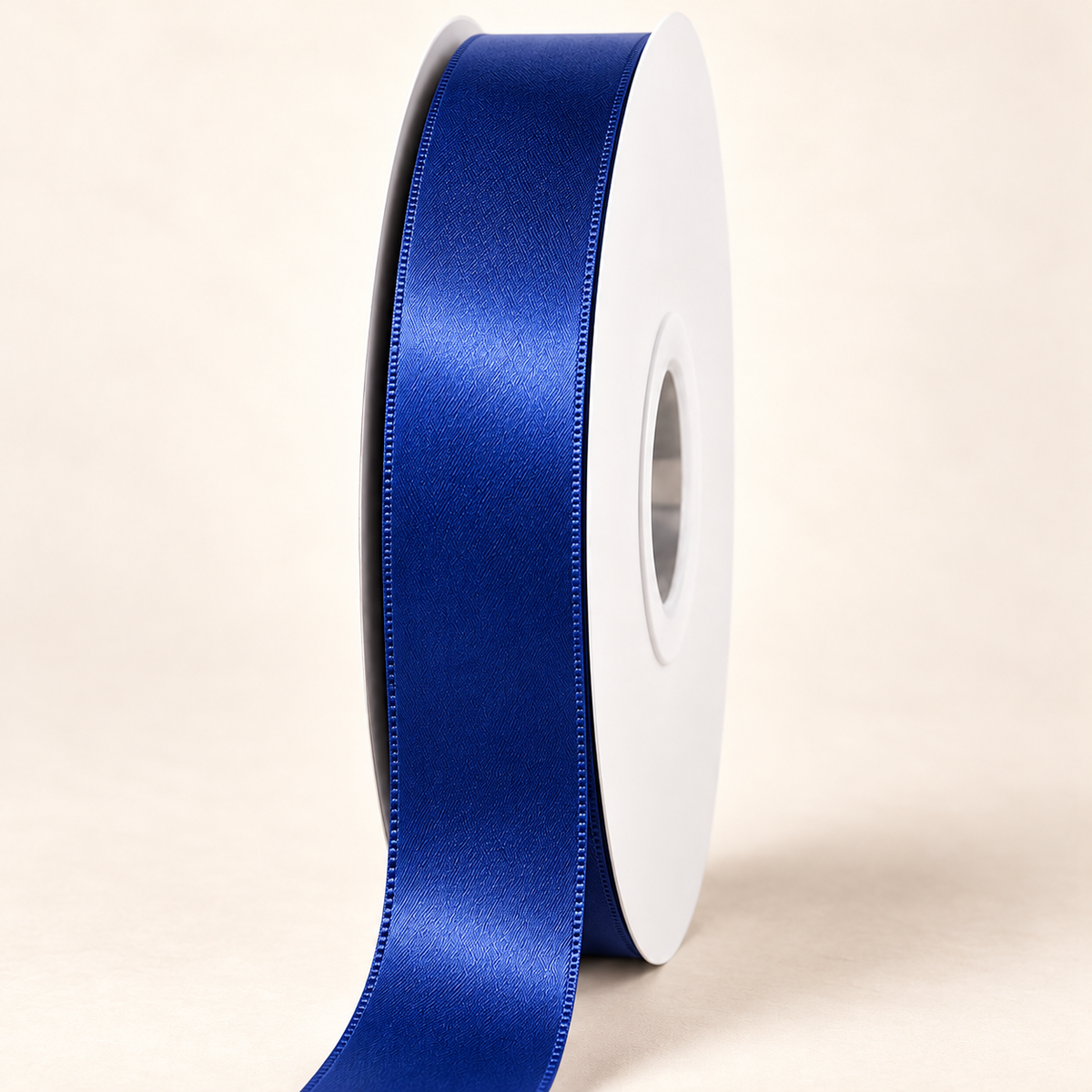 Viola — 22 mm satin ribbon on a white roll against an ivory background